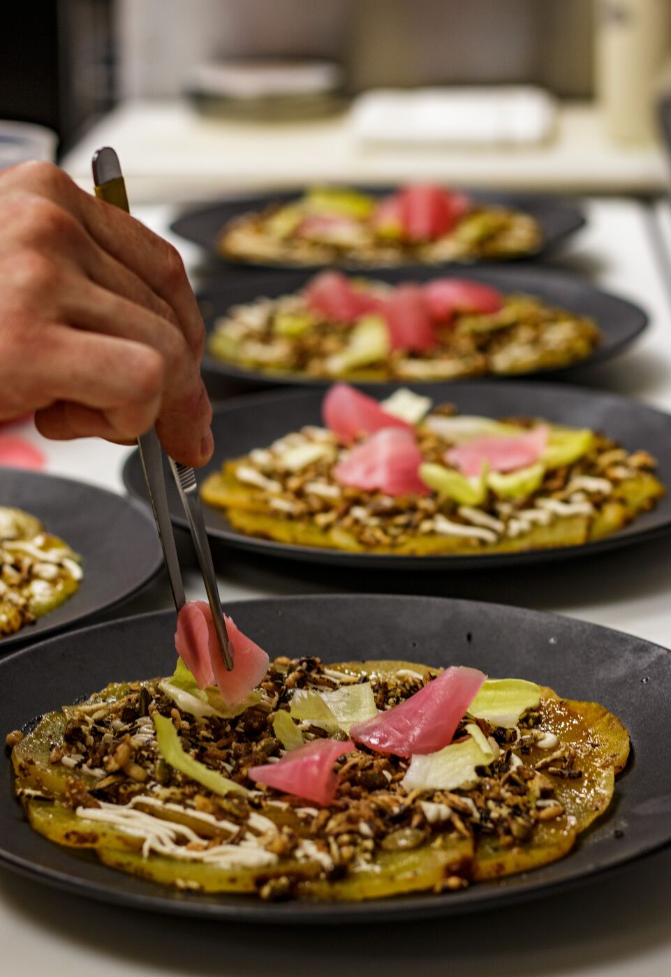 Chef plating at the pass